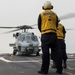 Sailors Prepare to Launch MH-60R Helicopter from USS Farragut in 5th Fleet