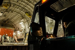Air Force Airman Operates Cargo Loader on C-17 Globemaster III