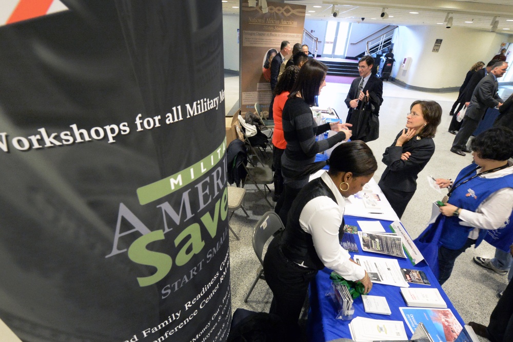 DoD Official Listens to Vendor at Military Saves Week Financial Fair