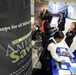 DoD Official Listens to Vendor at Military Saves Week Financial Fair