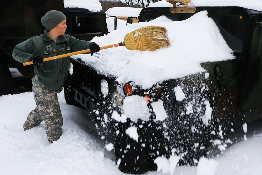 Virginia National Guard Troops Clear Snow from Humvees Ahead of Winter Storm