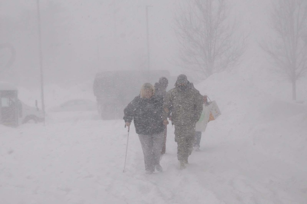 National Guard Soldier Assists Elderly Woman During Winter Storm Juno