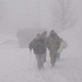 National Guard Soldier Assists Elderly Woman During Winter Storm Juno