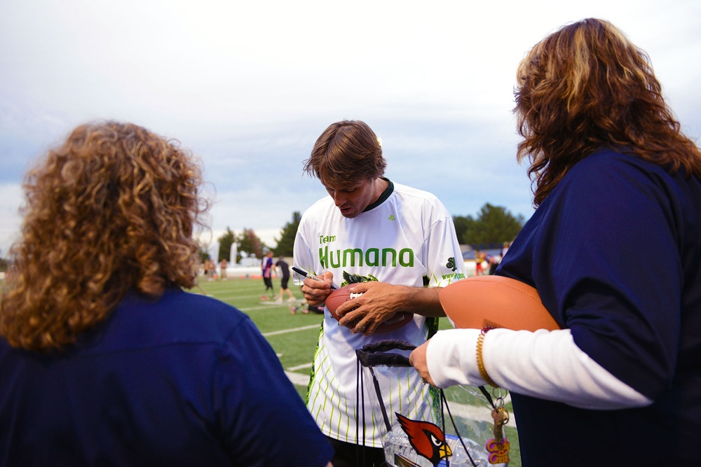 Former NFL Quarterback Jake Plummer Signs Footballs for Wounded Veterans