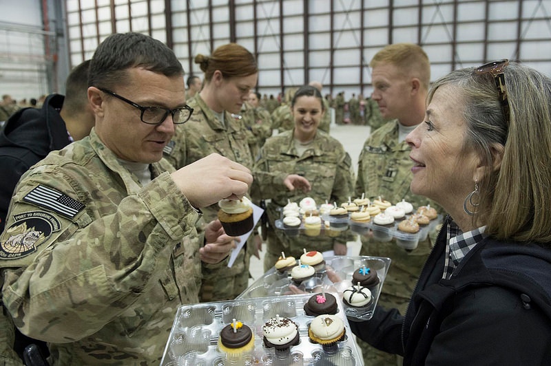 Volunteer Distributes Donated Cupcakes to Troops at Bagram Airfield