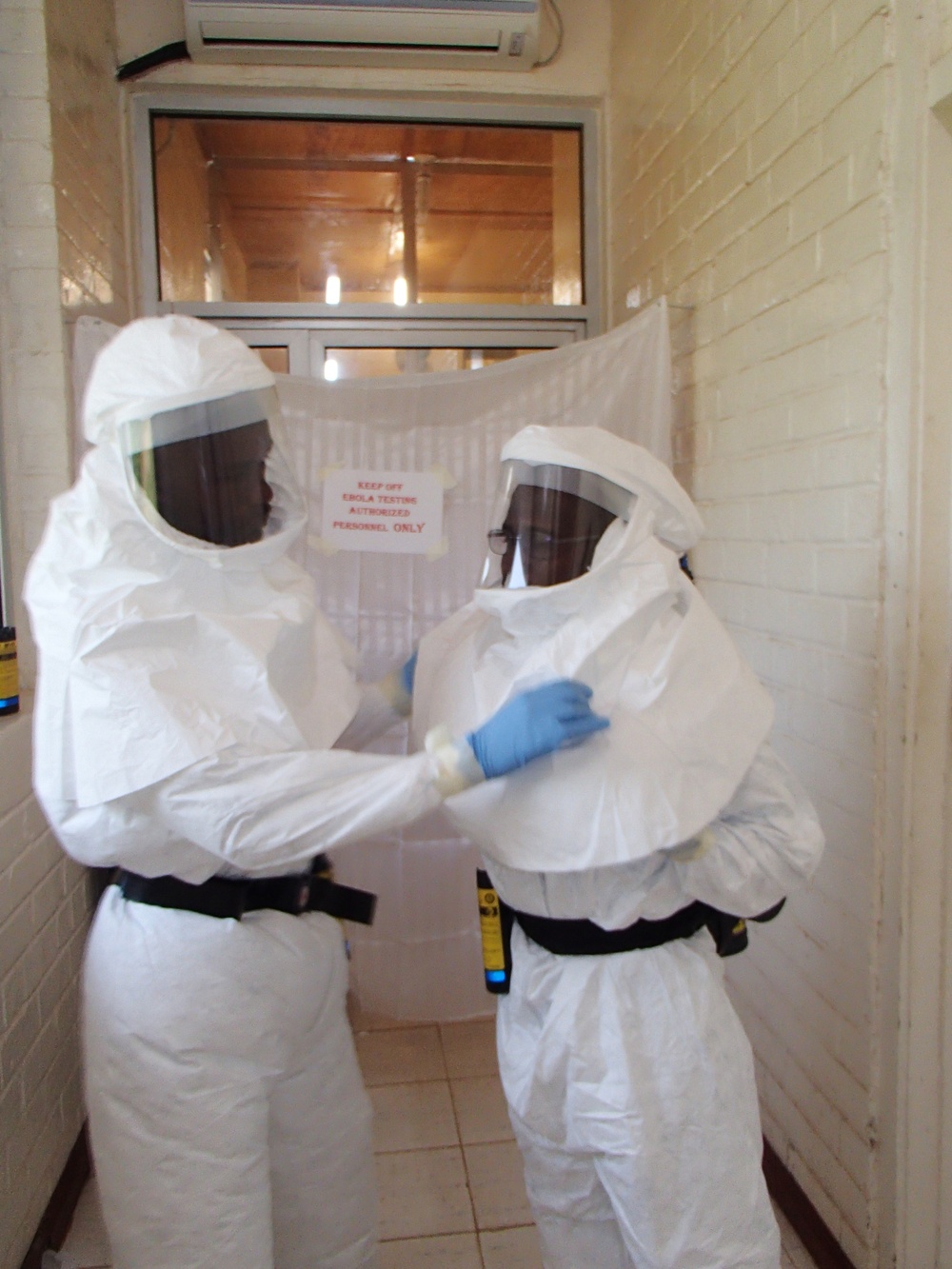 Liberian Lab Technicians Suit Up to Test Samples