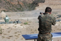 Marine Corpsman Trains with Shotgun During Grueling Hike