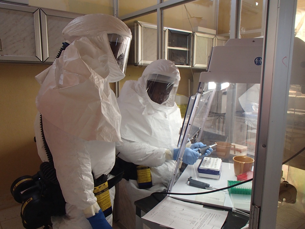 Technician Handles Ebola Samples in Containment Lab