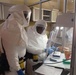 Technician Handles Ebola Samples in Containment Lab