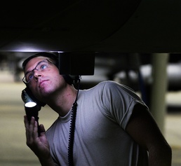 Air Force Crew Chief Inspects F-16 After Flight