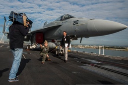 U.S. Navy Officer Demonstrates Aircraft Launch Procedure on Australian TV