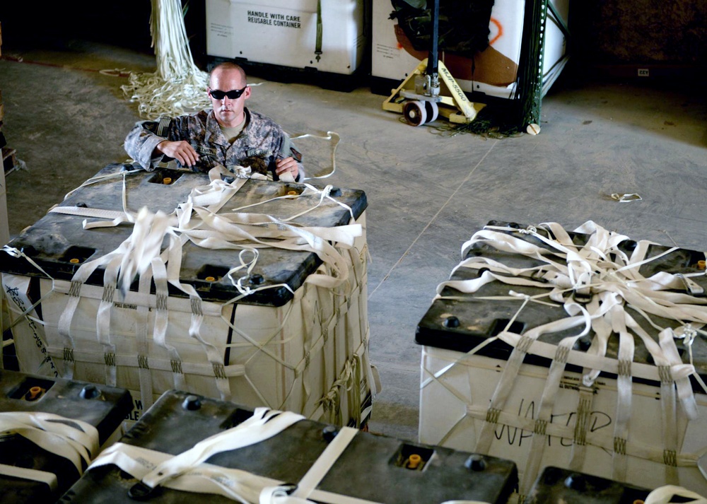 U.S. Soldier Palletizes Water for Humanitarian Air Drop to Displaced Yezidis in Iraq