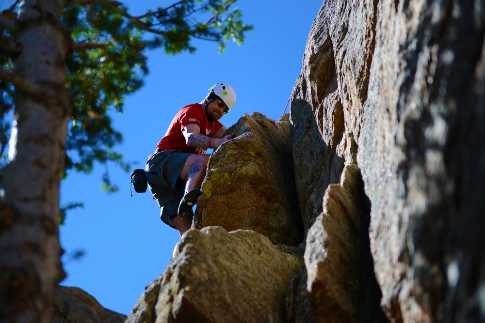 Army Veteran Scales Cliff at USO Rock-Climbing Camp