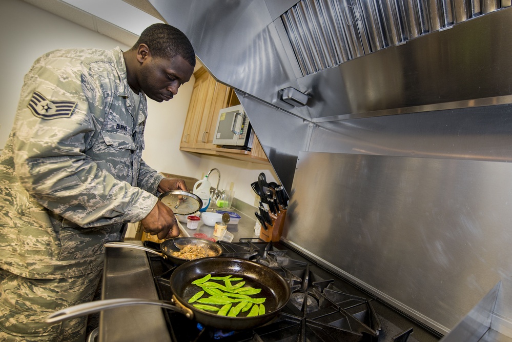 Air Force Airman Prepares Monterey Chicken at Moody Air Force Base