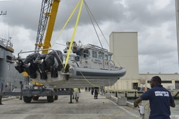 Grenadian Coast Guard Crew Member Handles Interceptor Response Boat During Tradewinds 2014