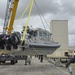 Grenadian Coast Guard Crew Member Handles Interceptor Response Boat During Tradewinds 2014
