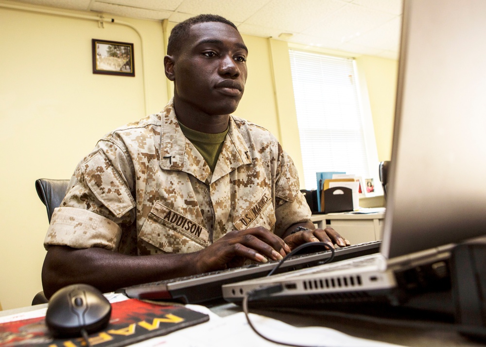 Marine Checks Morning Accountability Report at Camp Lejeune