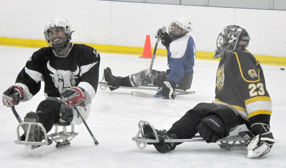 Sled Hockey Showdown: Rampage Forward Scores on Army Goaltender in Practice