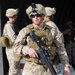 Marine Sergeant Prepares to Load Passengers and Gear onto Hercules Aircraft in Romania