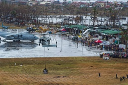 U.S. Navy Helicopter Delivers Aid to Typhoon-Ravaged Philippines