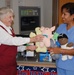 Volunteers Donate Handmade Toys to Military Hospital's Pediatric Clinic