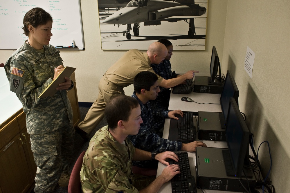 Cyber Flag 14-1 Participants Analyze Exercise Scenario at Nellis Air Force Base