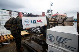 Navy Corpsman and Marine Sergeant Load Supplies for Typhoon Haiyan Relief Efforts in the Philippines