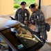 Identical Twin Airmen Check ID at Aviano Air Base