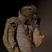 Marine Combat Engineer Braces Against Sand While Filling HESCO Barriers in Afghanistan
