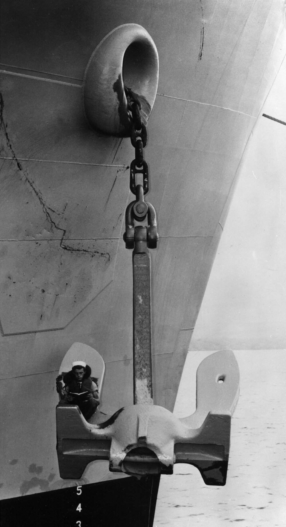 Sailor Discovers Cozy Reading Spot Aboard Ship