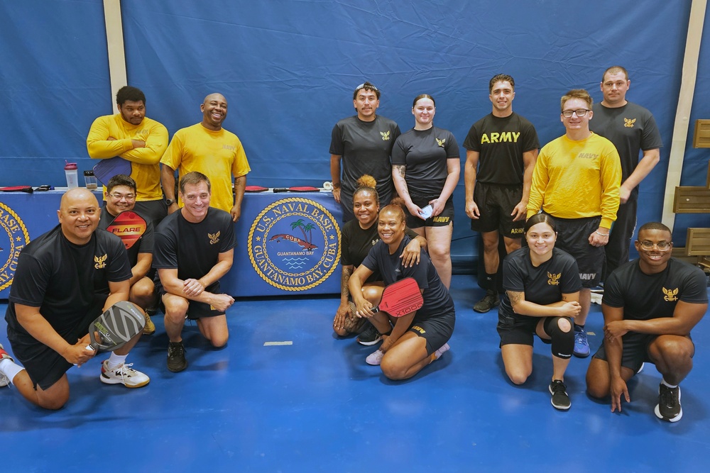 Capt. Bolls participates in PT with NS Guantanamo Bay Sailors