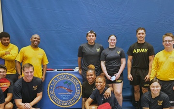 Capt. Bolls participates in PT with NS Guantanamo Bay Sailors