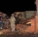 Guardsman and Firefighter Search Tornado Rubble for Survivors in Moore, Oklahoma