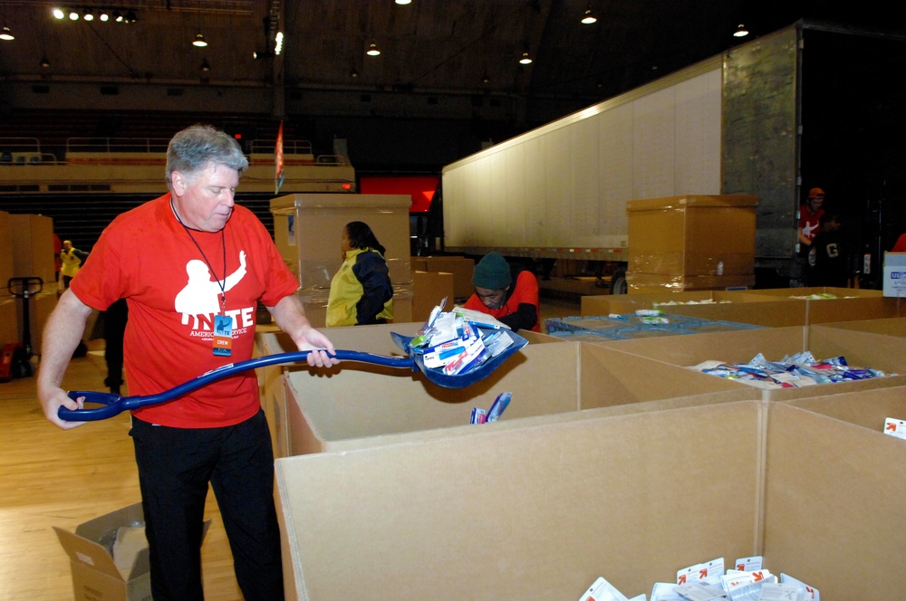 Volunteer Packs Care Kits for Deployed Troops at National Service Event