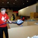 Volunteer Packs Care Kits for Deployed Troops at National Service Event