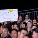 Soldier Holds Red Cross Poster Supporting U.S. Paralympic Athletes