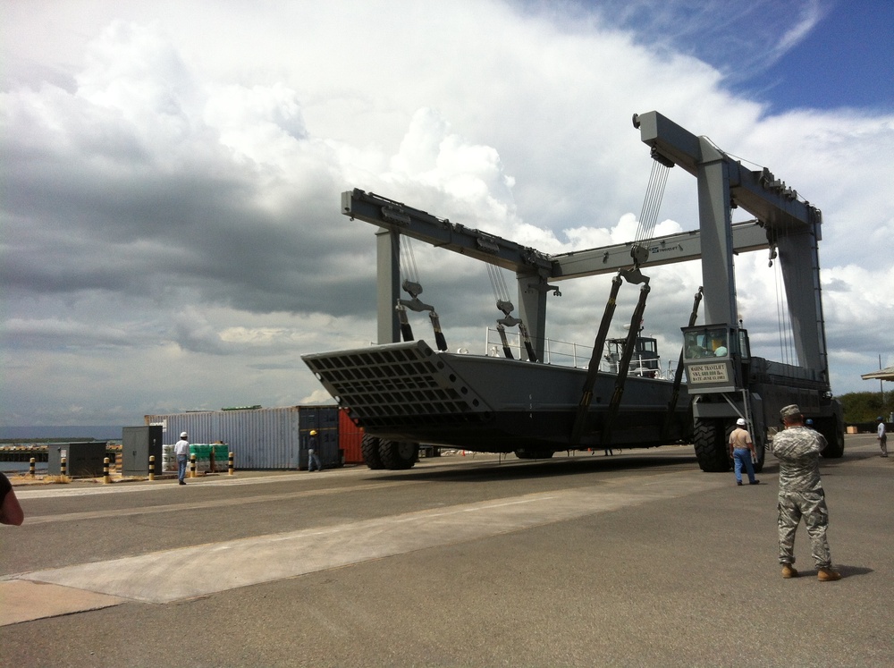 Massive Crane Prepares Boats for Tropical Storm Isaac at Guantanamo Bay