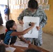 U.S. Army Captain Teaches Guatemalan Girl Dental Hygiene During Medical Training Exercise