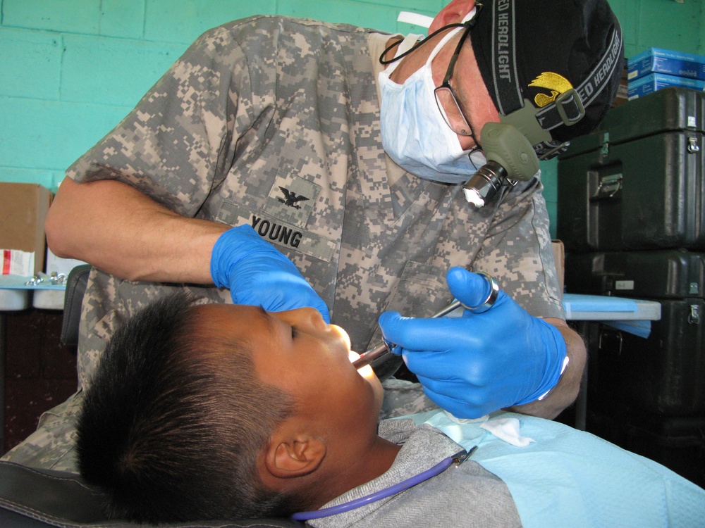 Army Doctor Provides Dental Care to Guatemalan Boy During Humanitarian Mission