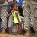 U.S. Troops Form Human Chain to Distribute Aid in Haiti