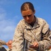 Marine Corps Radio Operator Prepares Unmanned Aerial Vehicle for Launch