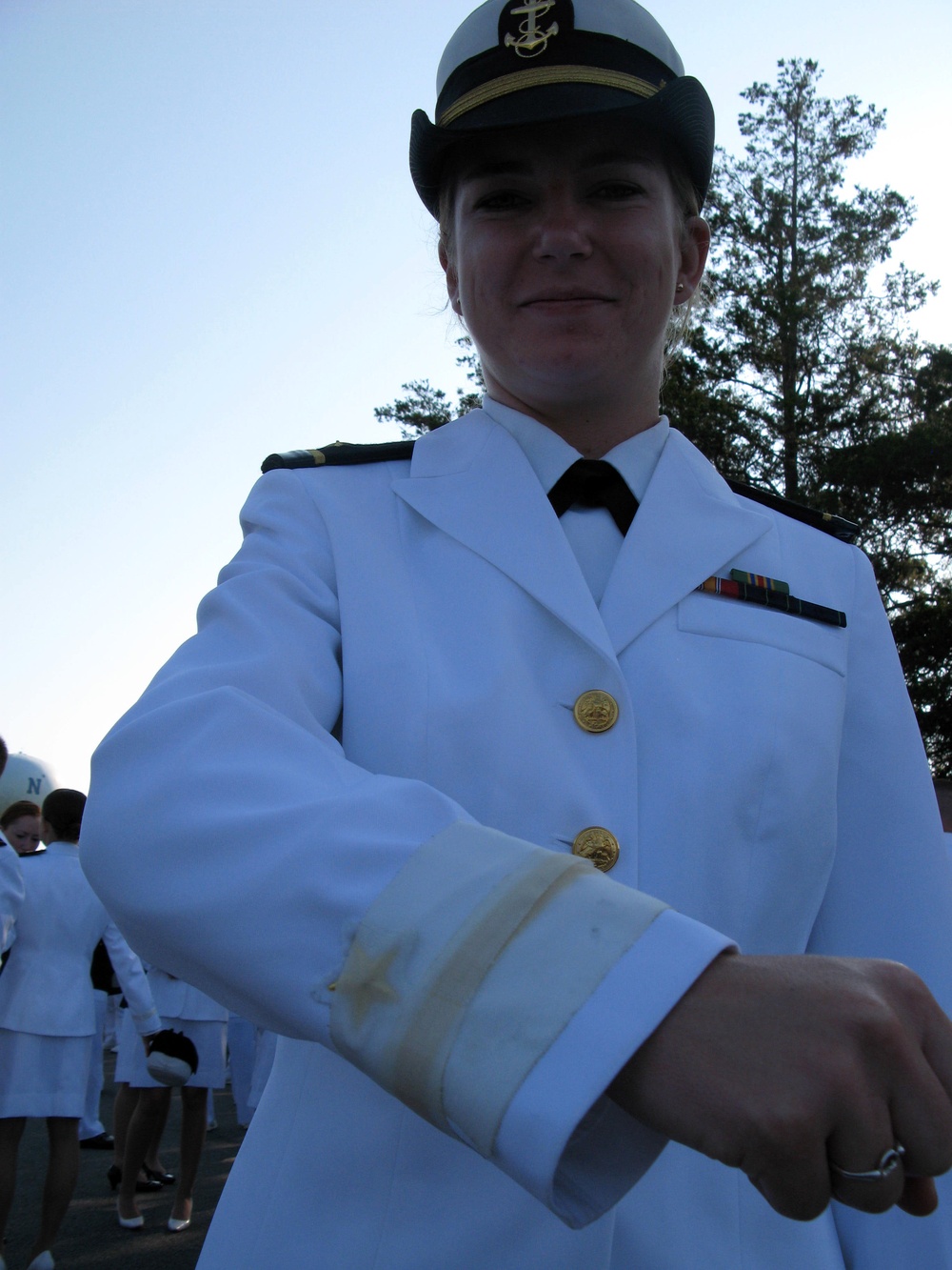 Naval Academy Graduate Reveals Officer Insignia at Commencement