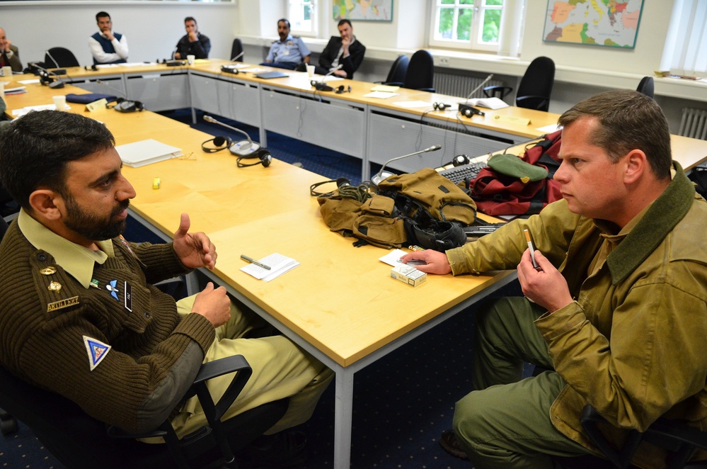 Pakistani Army Officer Negotiates with Warlord in Security Studies Exercise