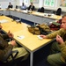 Pakistani Army Officer Negotiates with Warlord in Security Studies Exercise