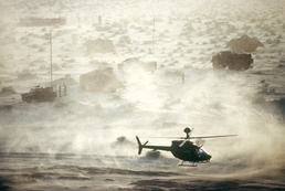 OH-58D Kiowa Helicopter Departs Communications Site in Desert During Desert Shield