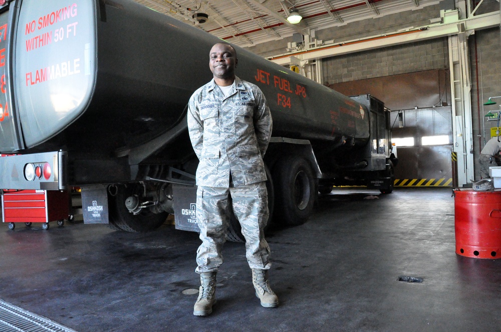 Air Force Capt. Okorodudu Stands Beside Fuel Tanker at Travis AFB