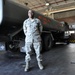Air Force Capt. Okorodudu Stands Beside Fuel Tanker at Travis AFB