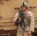 Marine Stands Beside Vehicle at Afghan Camp