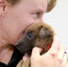 Military Working Dog Breeding Program Supervisor Cuddles Puppy