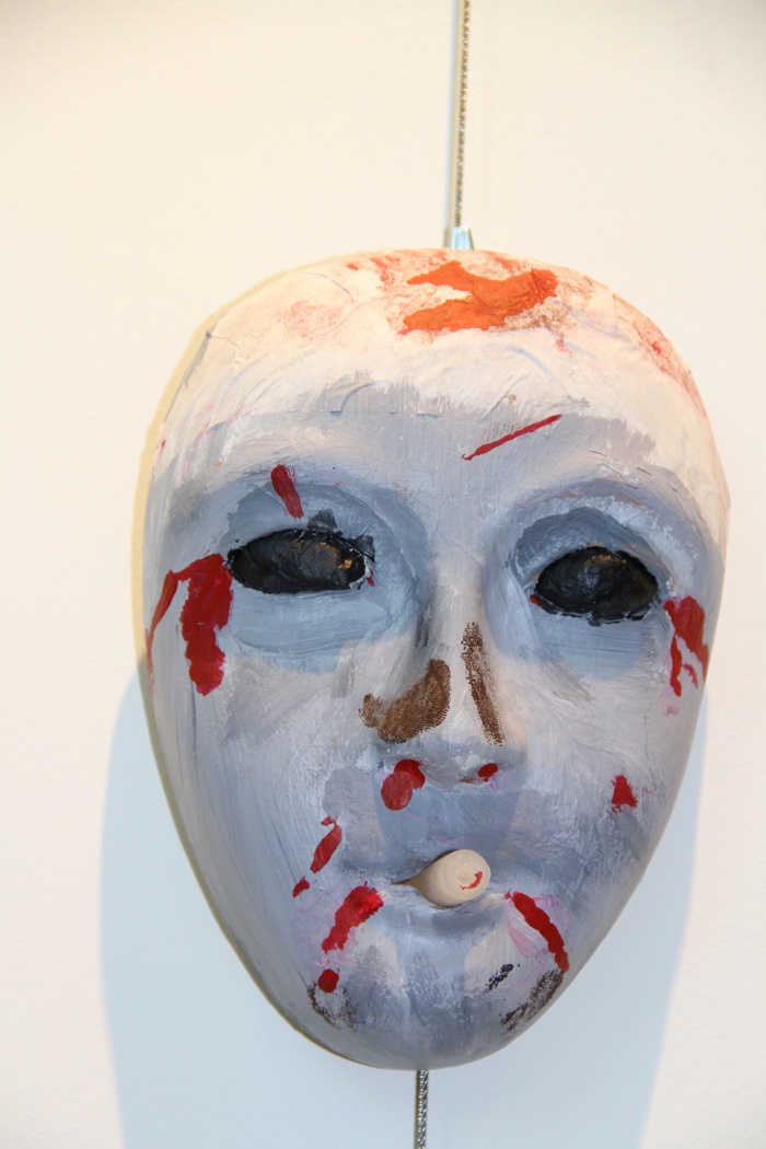 Service Member's Mask Reflects Grief Over Squad Mates' Deaths